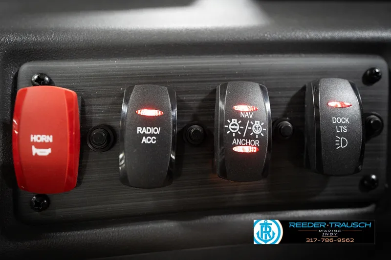 Slide: The Image of Control panel of 2026 Bennington 168 SLJ boat with labeled switches. - 32