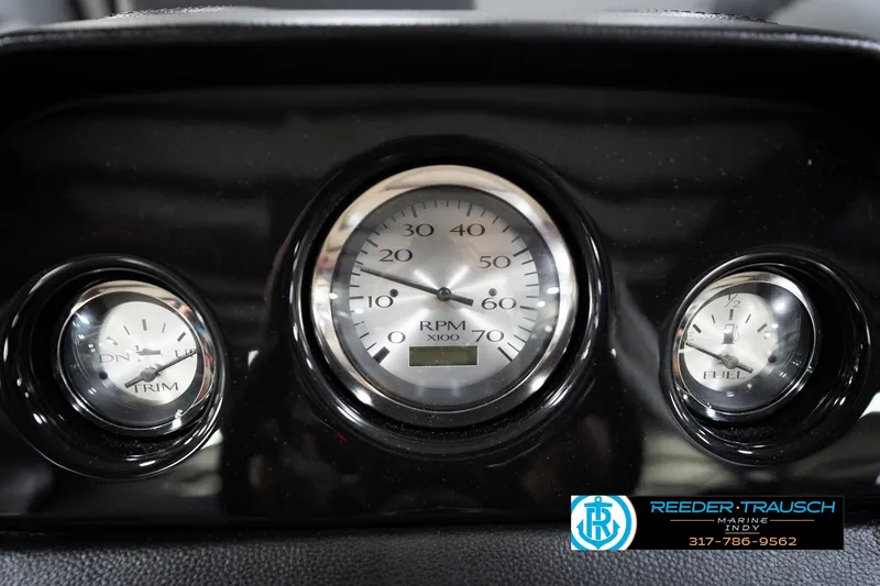 Slide: The Image of Dashboard gauges of 2026 Bennington 168 SLJ boat, featuring RPM, trim, and fuel indicators. - 34