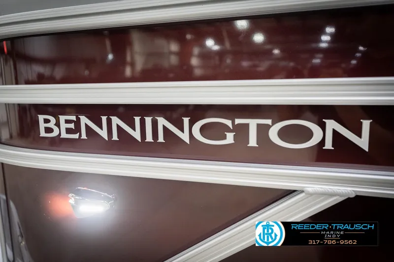 Slide: The Image of 2026 Bennington 168 SLJ boat with maroon finish and dealership logo. - 47