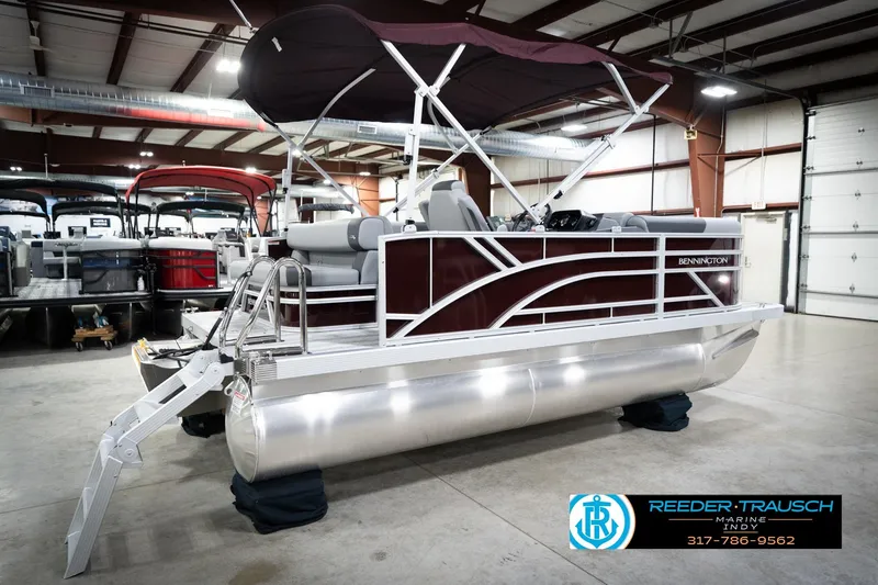Slide: The Image of 2026 Bennington 168 SLJ pontoon boat with canopy in showroom, side view. - 8