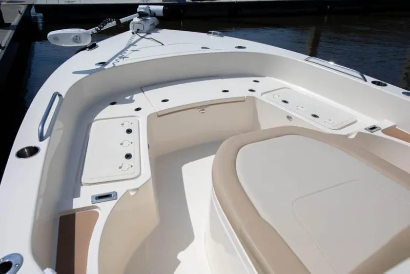 Slide: The Image of Manufacturer Provided Image: 2025 Scout 231 XSB boat interior with seating and storage compartments. - 4