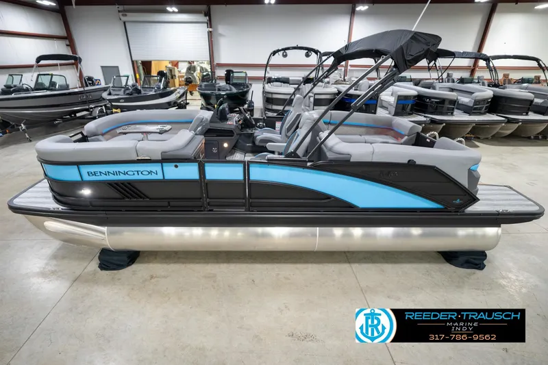 The Image of 2026 Bennington 22 MFB pontoon boat in showroom, featuring sleek design and modern amenities. - 0