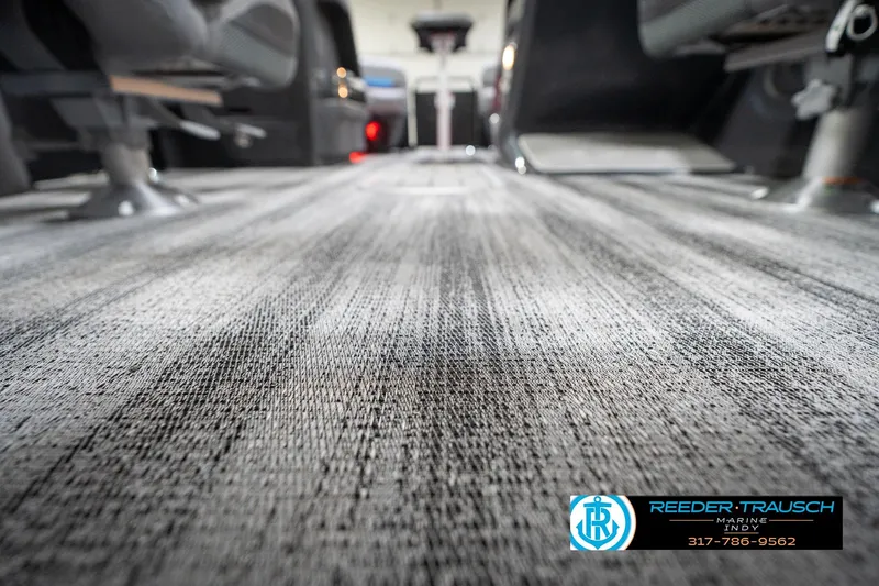 Slide: The Image of Interior view of 2026 Bennington 22 MFB boat, showcasing sleek flooring design. - 100