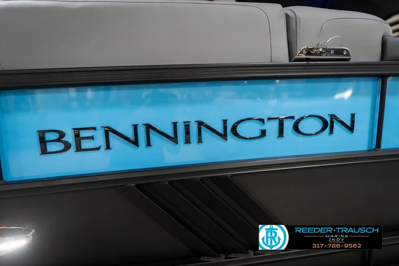 Slide: The Image of 2026 Bennington 22 MFB boat with illuminated logo and dealership contact information. - 102