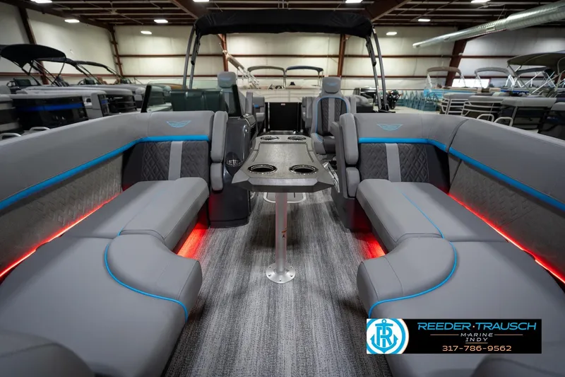 Slide: The Image of Interior of 2026 Bennington 22 MFB pontoon boat with gray seating and ambient lighting. - 16