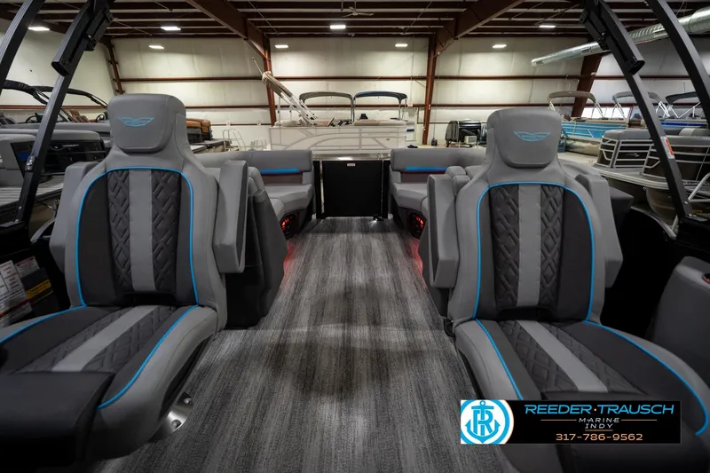 Slide: The Image of Luxurious interior of 2026 Bennington 22 MFB pontoon boat with LED lighting and plush seating. - 17