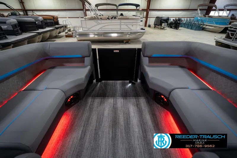Slide: The Image of 2026 Bennington 22 MFB pontoon boat interior with modern seating and ambient lighting. - 18