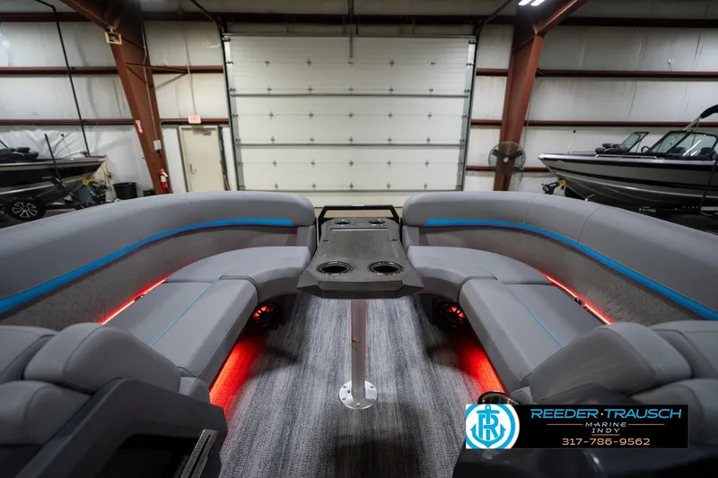 Slide: The Image of 2026 Bennington 22 MFB pontoon boat interior with LED lighting and plush seating. - 21