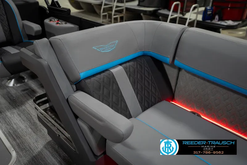 Slide: The Image of Luxurious interior of 2026 Bennington 22 MFB pontoon boat with LED lighting and plush seating. - 25