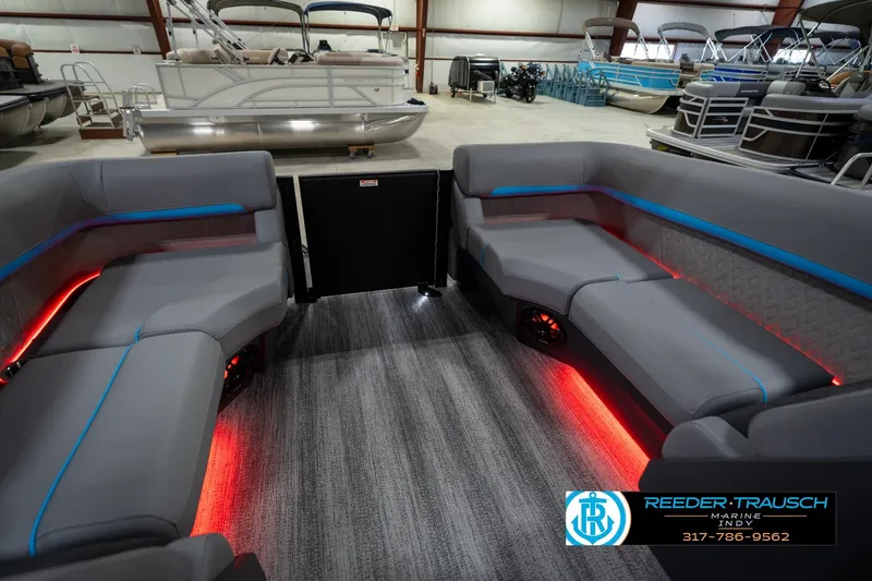 Slide: The Image of 2026 Bennington 22 MFB boat interior with modern seating and ambient lighting. - 26
