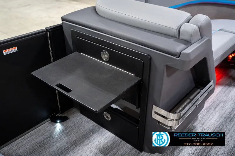 Slide: The Image of 2026 Bennington 22 MFB boat interior with gray and blue seating, featuring diamond stitching. - 29