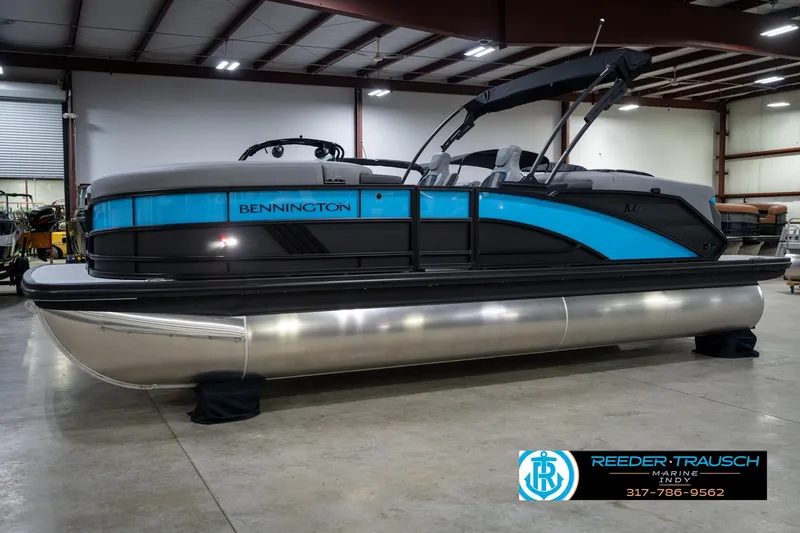Slide: The Image of Group enjoying a 2026 Bennington 22 MFB boat on a sunny day, promoting Reeder Trausch Marine services. - 3