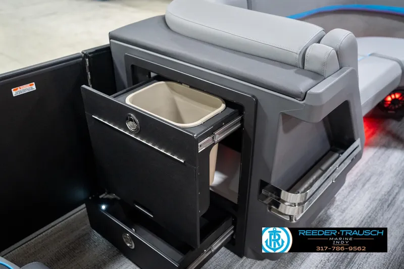 Slide: The Image of 2026 Bennington 22 MFB boat interior with gray and blue seating, red accent lighting. - 30