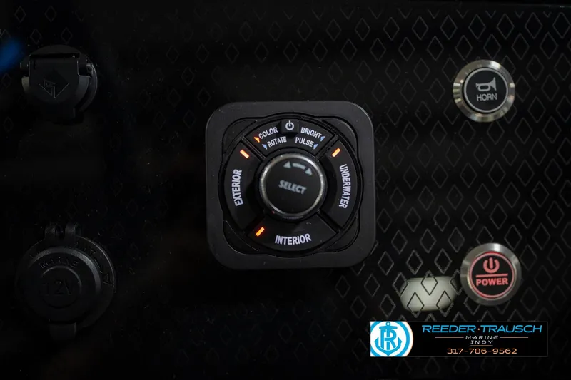 Slide: The Image of 2026 Bennington 22 MFB boat dashboard with steering wheel and digital display. - 37