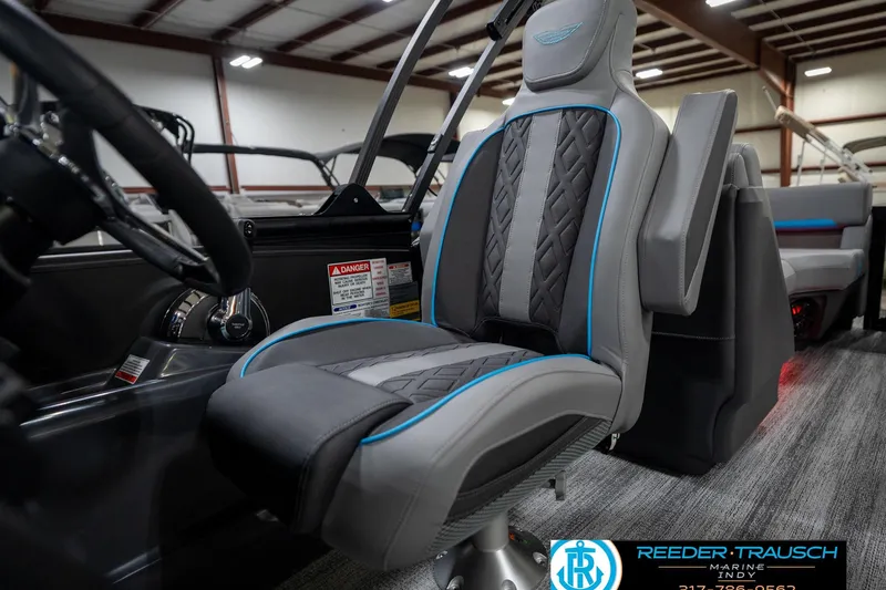 Slide: The Image of Close-up of 2026 Bennington 22 MFB steering wheel with Reeder-Trausch Marine logo. - 39