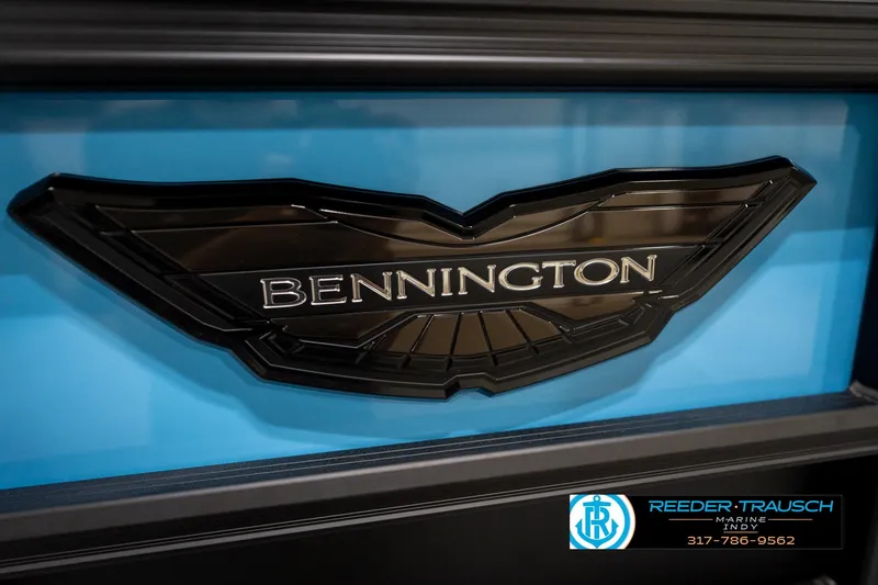 Slide: The Image of 2026 Bennington 22 MFB boat interior with gray seating, blue accents, and red LED lighting. - 48