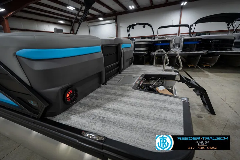 Slide: The Image of Illuminated cup holder on 2026 Bennington 22 MFB boat, featuring sleek design and red lighting. - 51