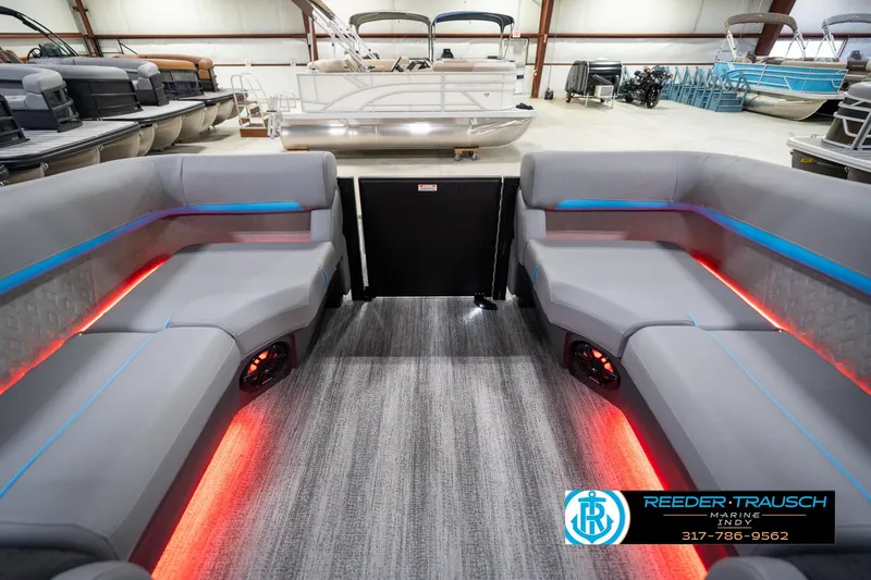 Slide: The Image of 2026 Bennington 22 MFB pontoon boat interior with LED lighting and plush seating. - 71