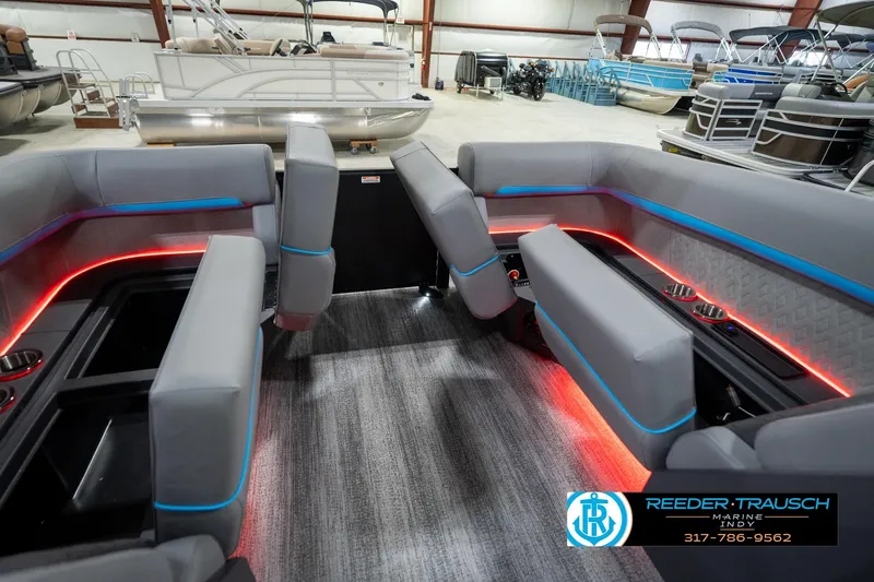 Slide: The Image of 2026 Bennington 22 MFB pontoon boat interior with LED lighting and modern seating. - 80