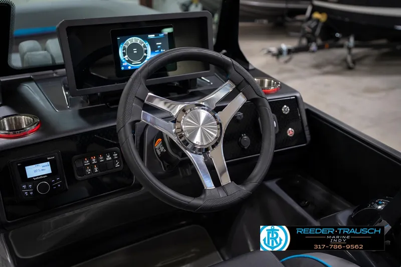 Slide: The Image of 2026 Bennington 22 MFB boat dashboard with modern steering wheel and digital display. - 85