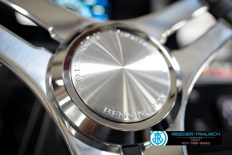 Slide: The Image of Close-up of 2026 Bennington 22 MFB steering wheel with Reeder-Trausch Marine logo. - 86