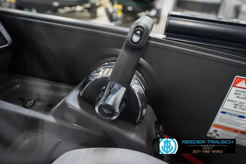 Slide: The Image of Throttle control of 2026 Bennington 22 MFB boat, featuring sleek design and warning labels. - 91