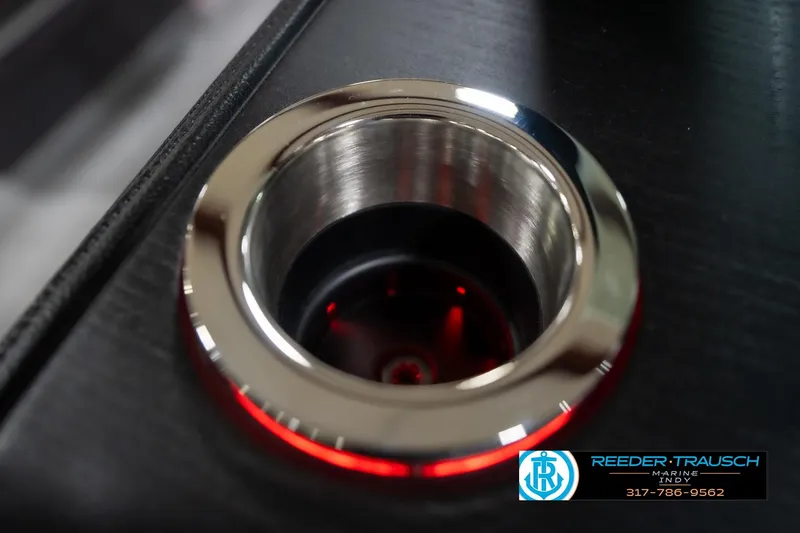 Slide: The Image of Illuminated cup holder on 2026 Bennington 22 MFB boat, featuring sleek design and red lighting. - 98