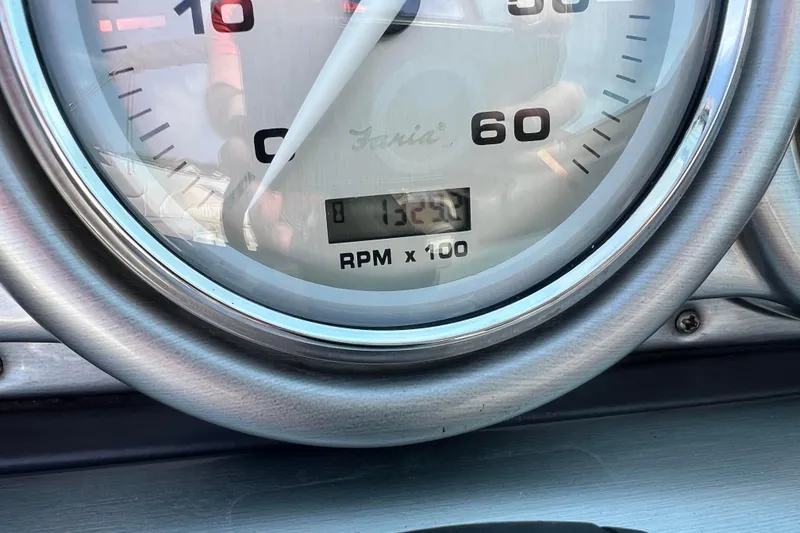 Slide: The Image of Close-up of Azure AZ240 2007 tachometer showing 1324 RPM. - 10