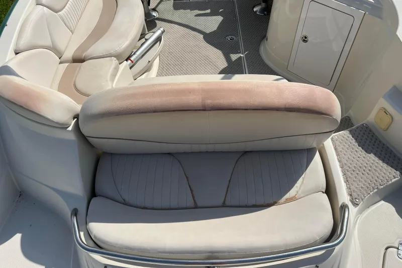 Slide: The Image of 2007 Azure AZ240 boat interior with beige seating and carpeted flooring. - 22