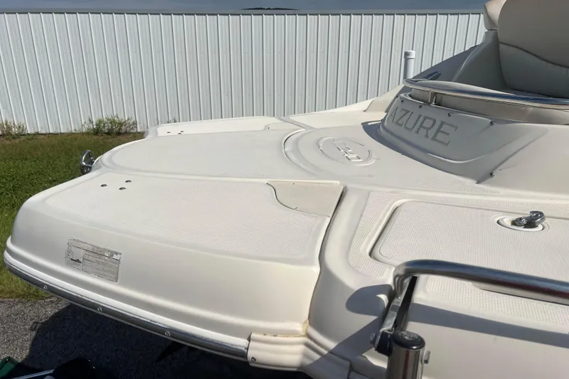 Slide: The Image of Rear view of a 2007 Azure AZ240 boat with white deck and railing. - 27