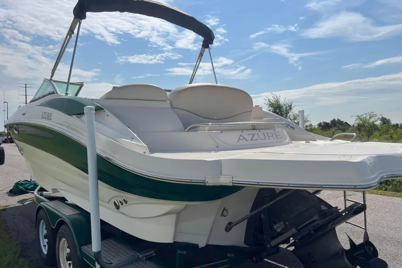 Slide: The Image of 2007 Azure AZ240 boat on trailer under clear sky, rear view. - 3