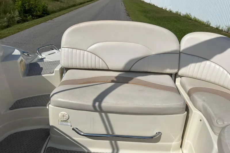 Slide: The Image of Boat seating on a 2007 Azure AZ240, featuring white and beige upholstery. - 42