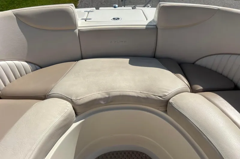 Slide: The Image of 2007 Azure AZ240 boat interior with beige cushioned seating. - 49
