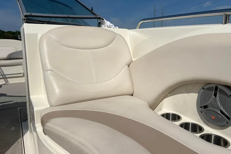 Slide: The Image of Cream leather seating on 2007 Azure AZ240 boat with cup holders and speaker. - 52