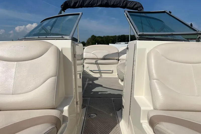 Slide: The Image of Interior view of a 2007 Azure AZ240 boat with beige leather seating. - 53