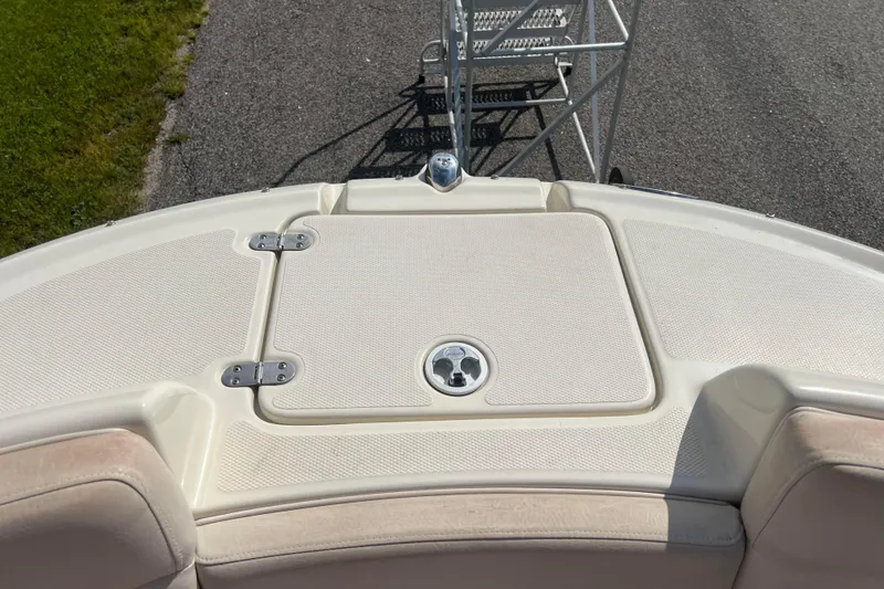 Slide: The Image of Bow of 2007 Azure AZ240 boat with hatch and ladder on pavement. - 55