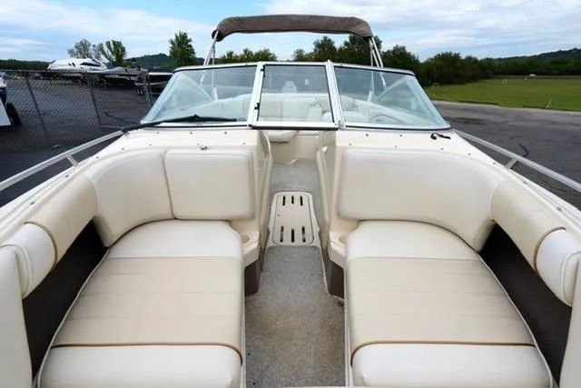Slide: The Image of 1995 Sea Ray 200 Select boat with white interior seating and open bow design. - 10