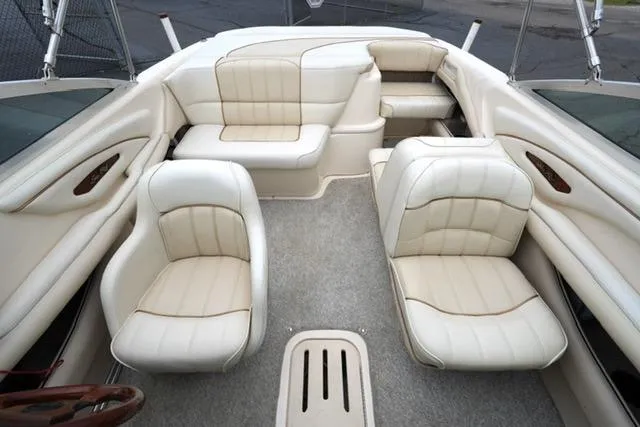 Slide: The Image of Interior of a 1995 Sea Ray 200 Select boat with cream leather seating. - 15