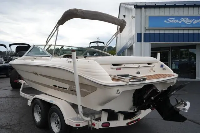 Slide: The Image of 1995 Sea Ray 200 Select boat on trailer, parked outside dealership. - 6