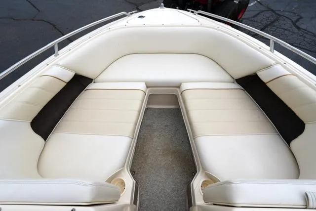 Slide: The Image of 1995 Sea Ray 200 Select boat interior with cream leather seating. - 8
