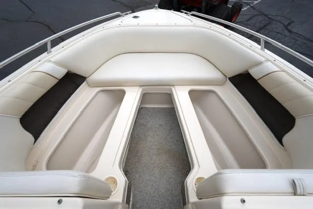 Slide: The Image of Interior view of 1995 Sea Ray 200 Select boat with white seating. - 9