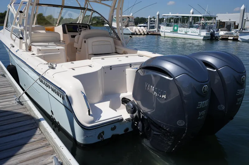 Slide: The Image of 2023 Grady-White Freedom 285 boat with twin Yamaha engines docked at marina. - 21