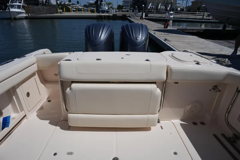 Slide: The Image of 2023 Grady-White Freedom 285 boat interior with dual engines at dock. - 22