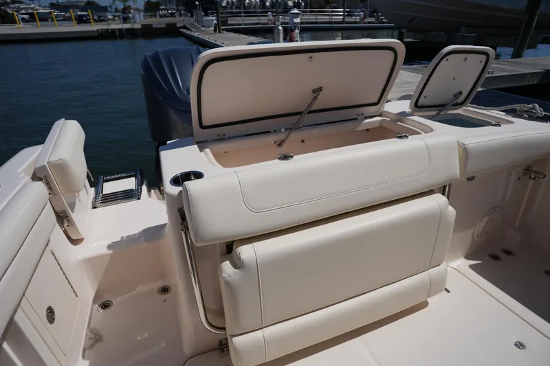 Slide: The Image of 2023 Grady-White Freedom 285 boat interior with open storage compartments. - 23