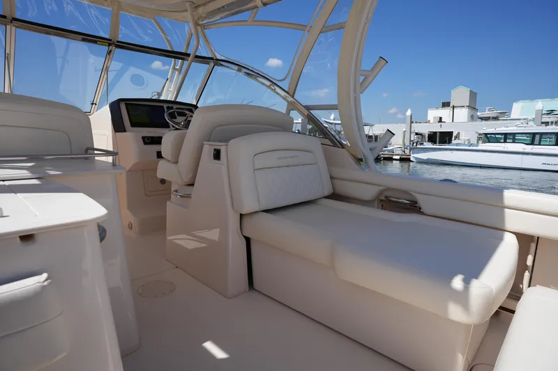 Slide: The Image of Interior of 2023 Grady-White Freedom 285 boat with luxurious seating and helm. - 31