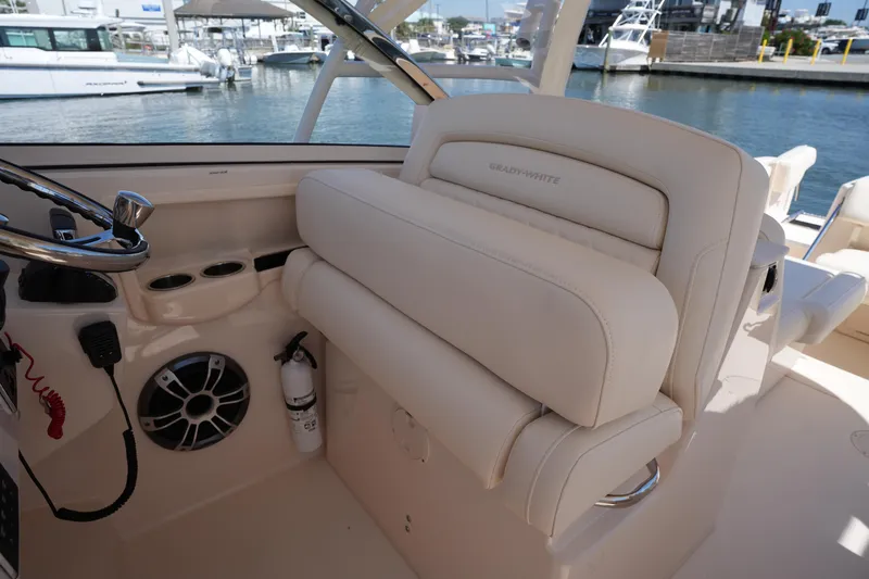 Slide: The Image of 2023 Grady-White Freedom 285 boat interior with helm, seating, and marine equipment. - 33