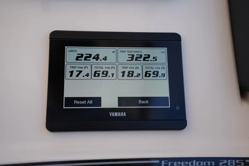 Slide: The Image of Yamaha display showing fuel usage and trip data on 2023 Grady-White Freedom 285 boat. - 38