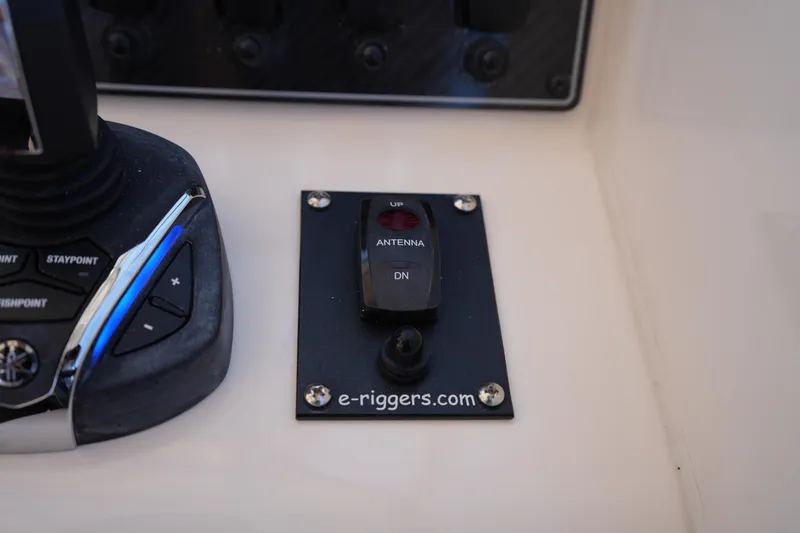 Slide: The Image of Control panel on 2023 Grady-White Freedom 285 boat with antenna switch and joystick. - 40