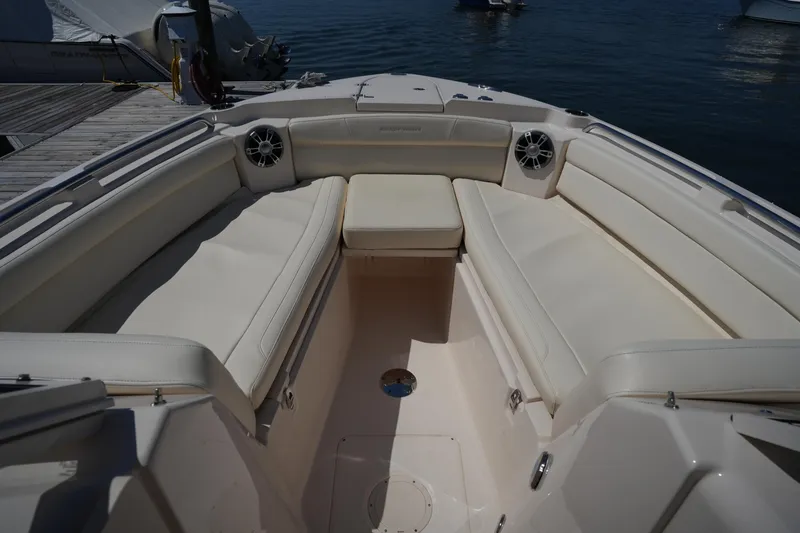 Slide: The Image of 2023 Grady-White Freedom 285 boat interior with spacious seating and speakers. - 44