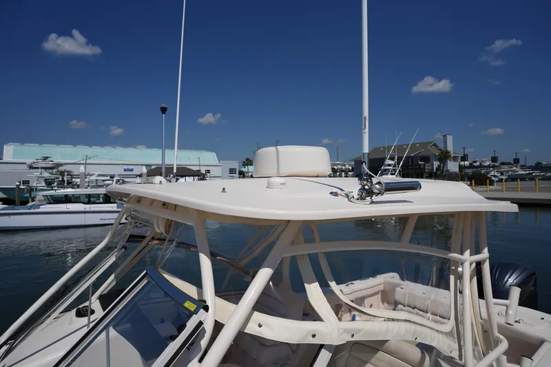 Slide: The Image of 2023 Grady-White Freedom 285 boat docked under clear blue sky. - 47